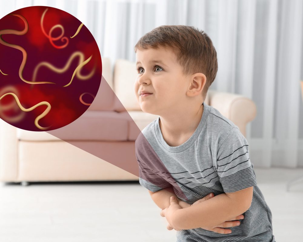 Parasites under microscope and boy suffering from helminthiasis